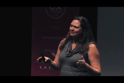 Screenshot of Christina giving the talk at UX Lausanne